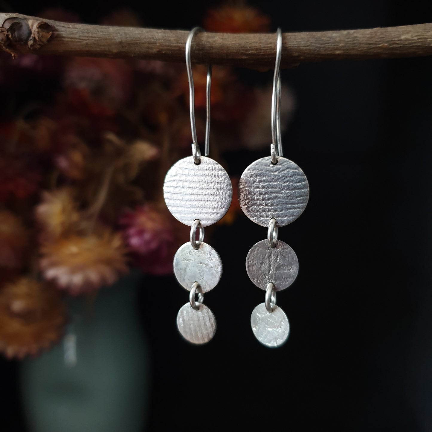 Silver multi disc/vintage lace imprint earrings